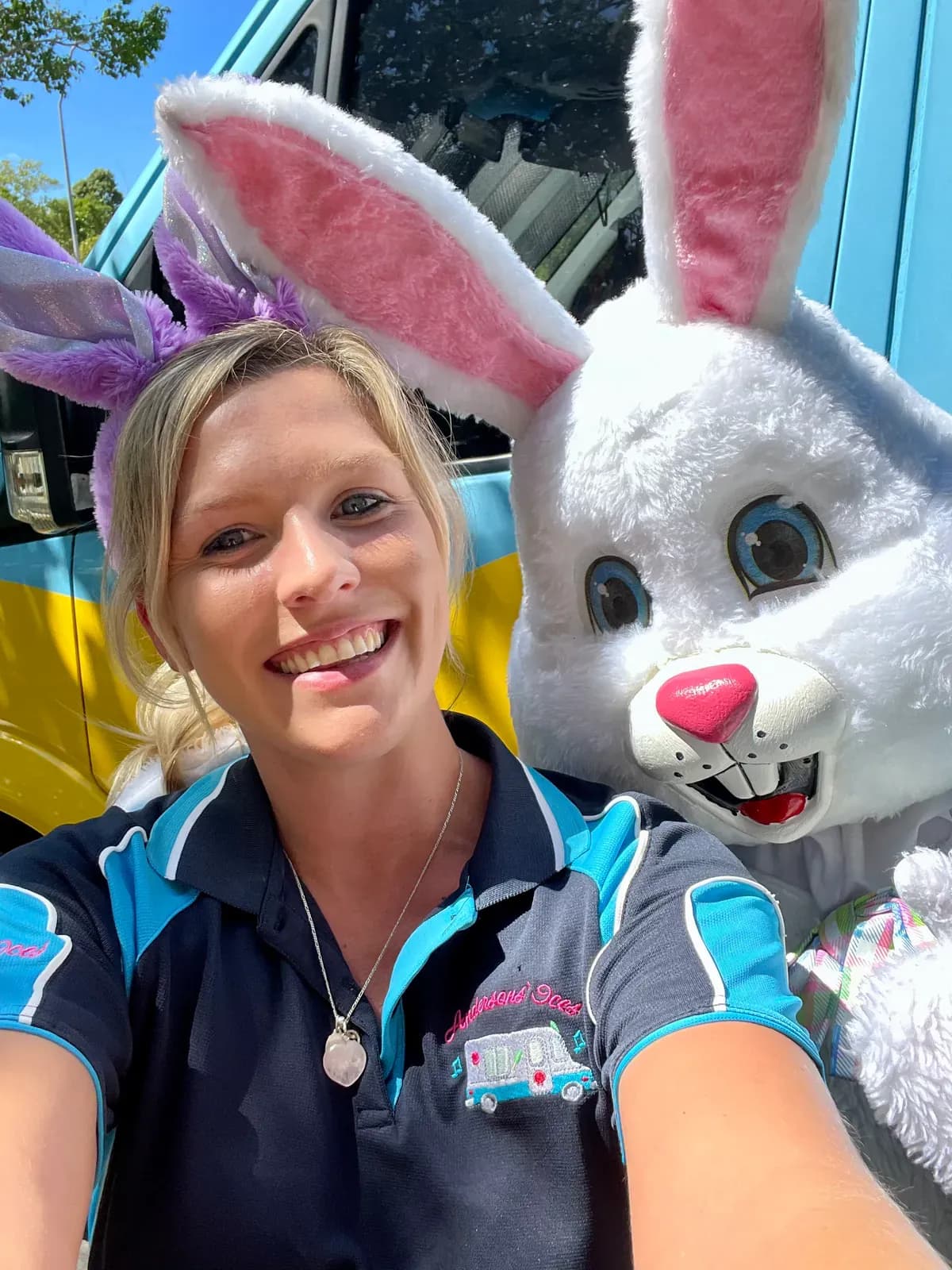 Sammy Anderson, owner of Andersons' Ices, wearing bunny ears beside the Easter Bunny at the van